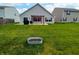 Well-maintained backyard featuring a patio area with pergola and a lush lawn at 878 Sommersweet Run, Greenwood, IN 46143