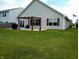 A spacious backyard with a pergola-covered patio, perfect for entertaining or relaxing outdoors at 878 Sommersweet Run, Greenwood, IN 46143