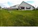 View of the expansive backyard and patio area with a pergola, ideal for outdoor relaxation at 878 Sommersweet Run, Greenwood, IN 46143