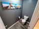 Modern bathroom with decorative wall art and gray walls at 878 Sommersweet Run, Greenwood, IN 46143