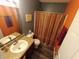 Comfortable bathroom featuring a vanity sink, toilet, and shower with neutral colored accents and flooring at 878 Sommersweet Run, Greenwood, IN 46143