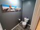 Modern bathroom with decorative wall art and gray walls at 878 Sommersweet Run, Greenwood, IN 46143