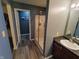 Well lit bathroom featuring a glass shower and dark granite vanity at 878 Sommersweet Run, Greenwood, IN 46143