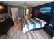 Bedroom featuring a striped bedspread, ceiling fan, and natural light from the window at 878 Sommersweet Run, Greenwood, IN 46143
