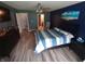 Bedroom featuring a striped bedspread, ceiling fan, and natural light from the window at 878 Sommersweet Run, Greenwood, IN 46143