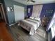 Serene bedroom featuring wood floors, ceiling fan, large closet, and natural lighting, creating a comfortable space at 878 Sommersweet Run, Greenwood, IN 46143
