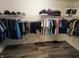 Walk-in closet featuring ample storage and wood-look floors at 878 Sommersweet Run, Greenwood, IN 46143