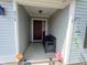 Inviting front porch with bench seating, decorative wreath, and charming accents, creating a welcoming entrance at 878 Sommersweet Run, Greenwood, IN 46143
