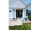 View of the front porch with a decorative entrance and an inviting walkway with charming landscape at 878 Sommersweet Run, Greenwood, IN 46143
