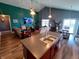 Modern kitchen with a spacious island, open layout, and seamless flow to the living and dining areas at 878 Sommersweet Run, Greenwood, IN 46143