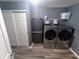 Laundry room with washer, dryer, utility closet, and storage at 878 Sommersweet Run, Greenwood, IN 46143
