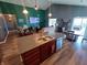 Open-concept living space with modern kitchen, dining area, and comfortable living room at 878 Sommersweet Run, Greenwood, IN 46143