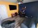 Living room featuring television, desk, chair, sofa, and gray papasan chair at 878 Sommersweet Run, Greenwood, IN 46143