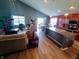 Open-concept living room flowing into the dining area and kitchen, creating a spacious and inviting atmosphere at 878 Sommersweet Run, Greenwood, IN 46143