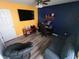 Living room featuring television, desk, chair, sofa, and gray papasan chair at 878 Sommersweet Run, Greenwood, IN 46143