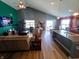 Bright and open living room featuring vaulted ceilings and a seamless flow to the kitchen at 878 Sommersweet Run, Greenwood, IN 46143