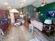 Open-concept design showcases a modern kitchen with island, living area and a large screen television at 878 Sommersweet Run, Greenwood, IN 46143