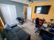 Living room featuring television, desk, chair, sofa, and gray papasan chair at 878 Sommersweet Run, Greenwood, IN 46143