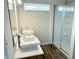 A well-lit bathroom featuring a glass-door shower and a double vessel sink vanity at 883 Halyard Dr, Avon, IN 46123