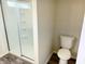 Bathroom showcases a clean, bright shower stall and efficient toilet at 883 Halyard Dr, Avon, IN 46123