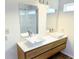 Bathroom featuring double sinks, a modern vanity and wood grain flooring at 883 Halyard Dr, Avon, IN 46123