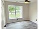 Bedroom with a window view features modern vinyl flooring and a ceiling fan at 883 Halyard Dr, Avon, IN 46123
