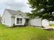 Charming home featuring vinyl siding, manicured landscaping, and an attached two-car garage at 883 Halyard Dr, Avon, IN 46123