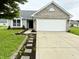 Charming single-Gathering home with a well-maintained lawn, brick accents, and a two-car garage at 883 Halyard Dr, Avon, IN 46123