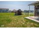 Large backyard with a shed and basketball hoop, accessible from the covered patio at 9001 Fitzgerald Dr, Indianapolis, IN 46239