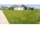 Expansive backyard with manicured lawn, white privacy fence and neat shrubs at 9001 Fitzgerald Dr, Indianapolis, IN 46239