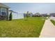 Well-maintained lawn, privacy fence, and neat shrubbery in this great backyard space at 9001 Fitzgerald Dr, Indianapolis, IN 46239