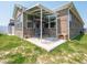 Cozy covered patio includes swing seating and a well-maintained concrete pad at 9001 Fitzgerald Dr, Indianapolis, IN 46239