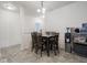 Well-lit dining area features a table with seating for six and tile flooring at 9001 Fitzgerald Dr, Indianapolis, IN 46239