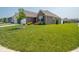 Lovely brick home featuring a well-manicured lawn and mature landscaping at 9001 Fitzgerald Dr, Indianapolis, IN 46239