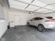 Spacious two car garage featuring a silver SUV and additional storage space at 9001 Fitzgerald Dr, Indianapolis, IN 46239