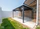 View of a modern gazebo on a concrete pad with a white privacy fence at 9001 Fitzgerald Dr, Indianapolis, IN 46239