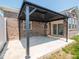 Stylish black gazebo with a concrete pad, set against the brick exterior at 9001 Fitzgerald Dr, Indianapolis, IN 46239