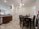 Bright eat-in kitchen features tile floors, stainless steel appliances, and wood cabinets at 9001 Fitzgerald Dr, Indianapolis, IN 46239