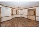 Cozy dining area with hardwood floors, large windows, and a stylish light fixture, perfect for Gathering meals at 9133 Log Run N Dr, Indianapolis, IN 46234