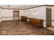 Open dining room with built in wood cabinets, hardwood floors and decorative trim at 9133 Log Run N Dr, Indianapolis, IN 46234