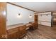 Open dining room with built in wood cabinets, hardwood floors and decorative trim at 9133 Log Run N Dr, Indianapolis, IN 46234