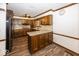 Traditional kitchen with wood cabinets, granite countertops, and stainless steel appliances, creating a functional and stylish space at 9133 Log Run N Dr, Indianapolis, IN 46234