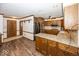 Traditional kitchen with wood cabinets, granite countertops, and stainless steel appliances at 9133 Log Run N Dr, Indianapolis, IN 46234