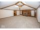 Expansive living room boasts vaulted ceilings, brick fireplace, built-in bookshelves, and abundant natural light at 9133 Log Run N Dr, Indianapolis, IN 46234