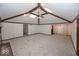 Spacious living room with vaulted ceilings, exposed beams, skylights, and a traditional brick fireplace at 9133 Log Run N Dr, Indianapolis, IN 46234