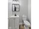 Bathroom featuring a white vanity, toilet, and light wood floors at 9148 Oak Knoll Ln, Fishers, IN 46037