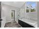 Elegant bathroom featuring a soaking tub, glass shower, marble surround, and stylish finishes at 9148 Oak Knoll Ln, Fishers, IN 46037