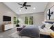 Cozy bedroom with large windows, ample natural light, and a ceiling fan at 9148 Oak Knoll Ln, Fishers, IN 46037