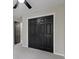 Bedroom featuring a closet with black bi-fold doors and carpet floors at 9148 Oak Knoll Ln, Fishers, IN 46037
