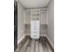 Organized walk-in closet with modern drawers, shelving, and hanging rods offers ample storage at 9148 Oak Knoll Ln, Fishers, IN 46037